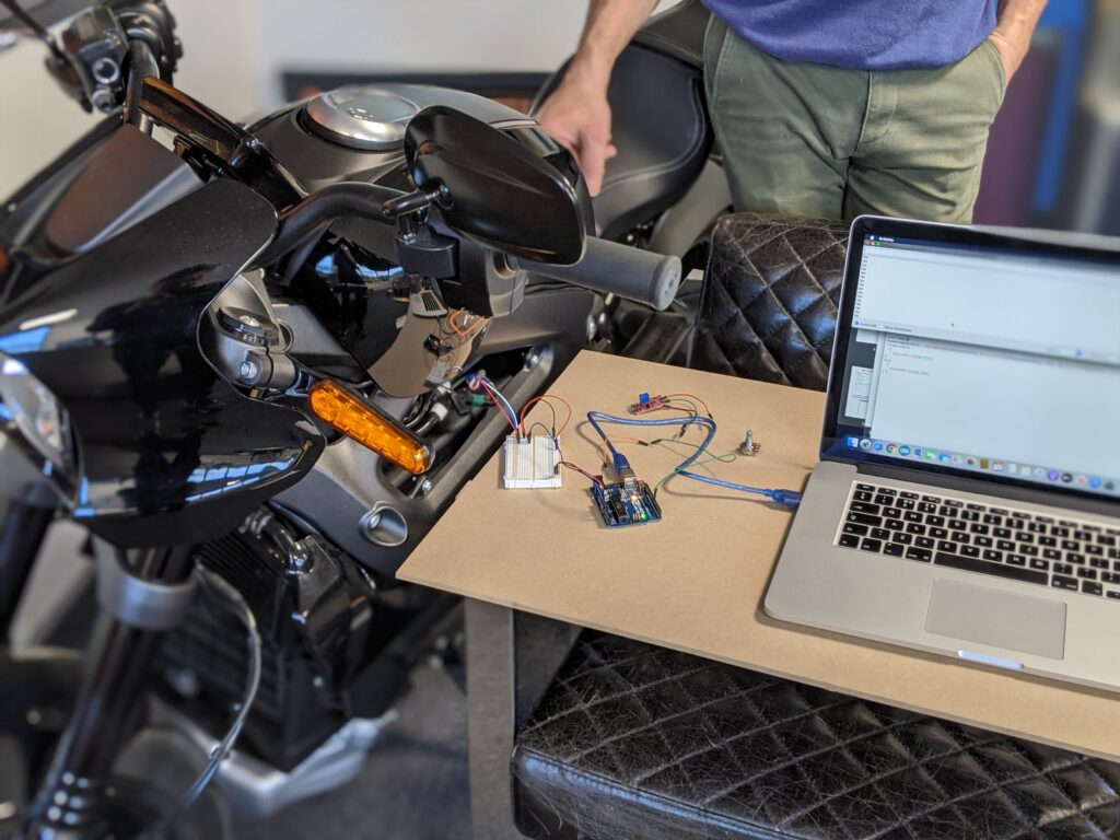 Electronics connecting a Harley Davidson motorbike to a Macbook computer